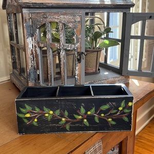 Hand painted wooden box with branch decoration.